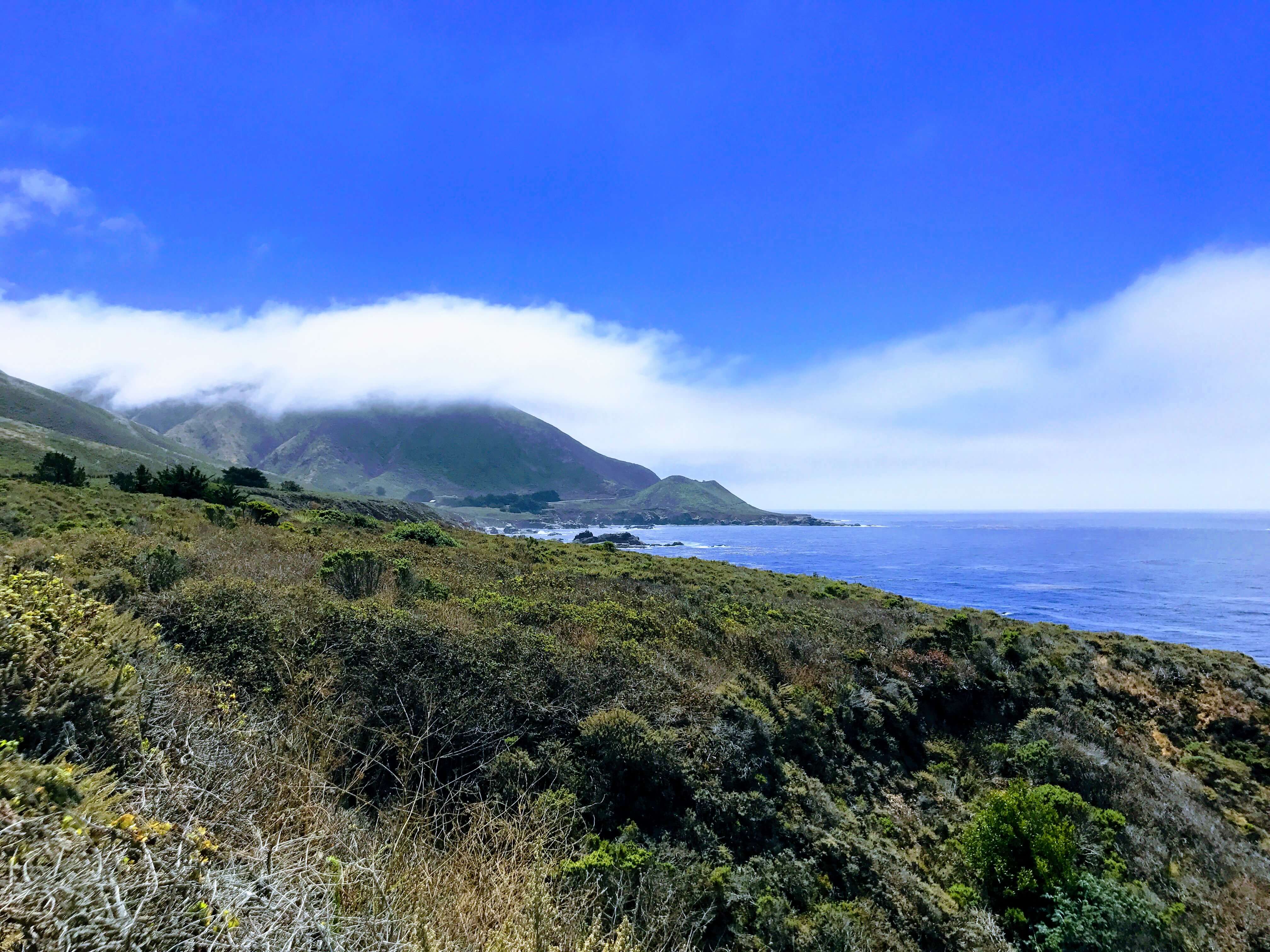 California Coastline near big sure, mountain formation with clouds and ocean view