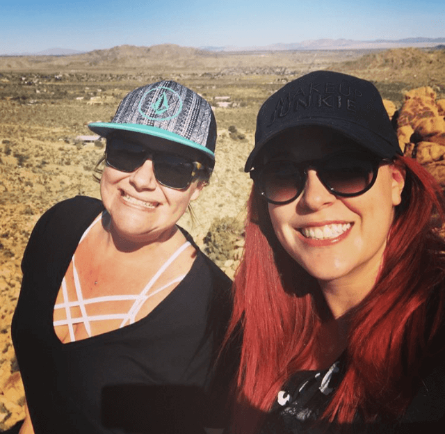 Rheannon and Jordi Selfie at the top of a rock mountain in joshua tree