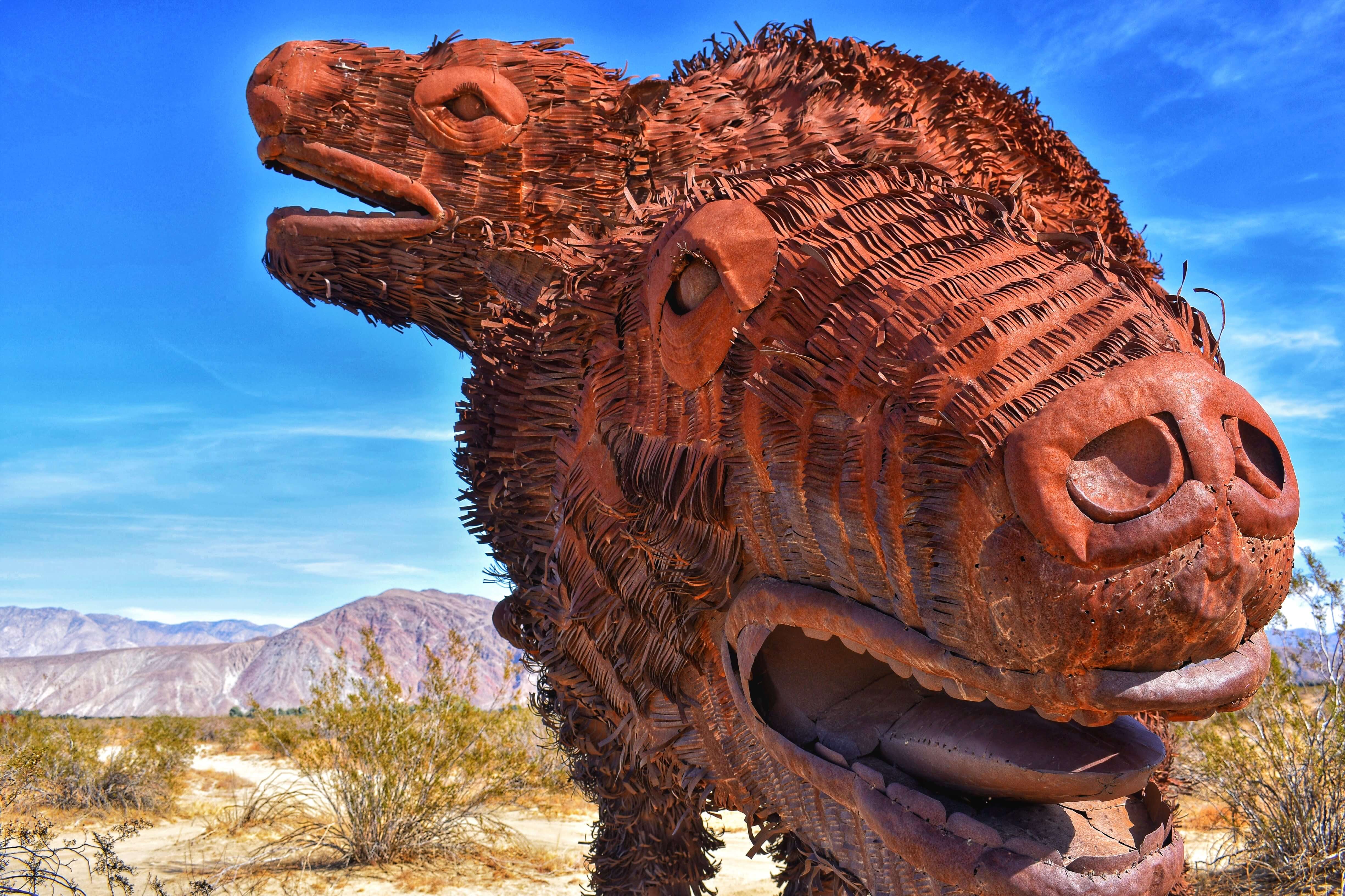 Desert sculpture with metal hair in the desert, two heads