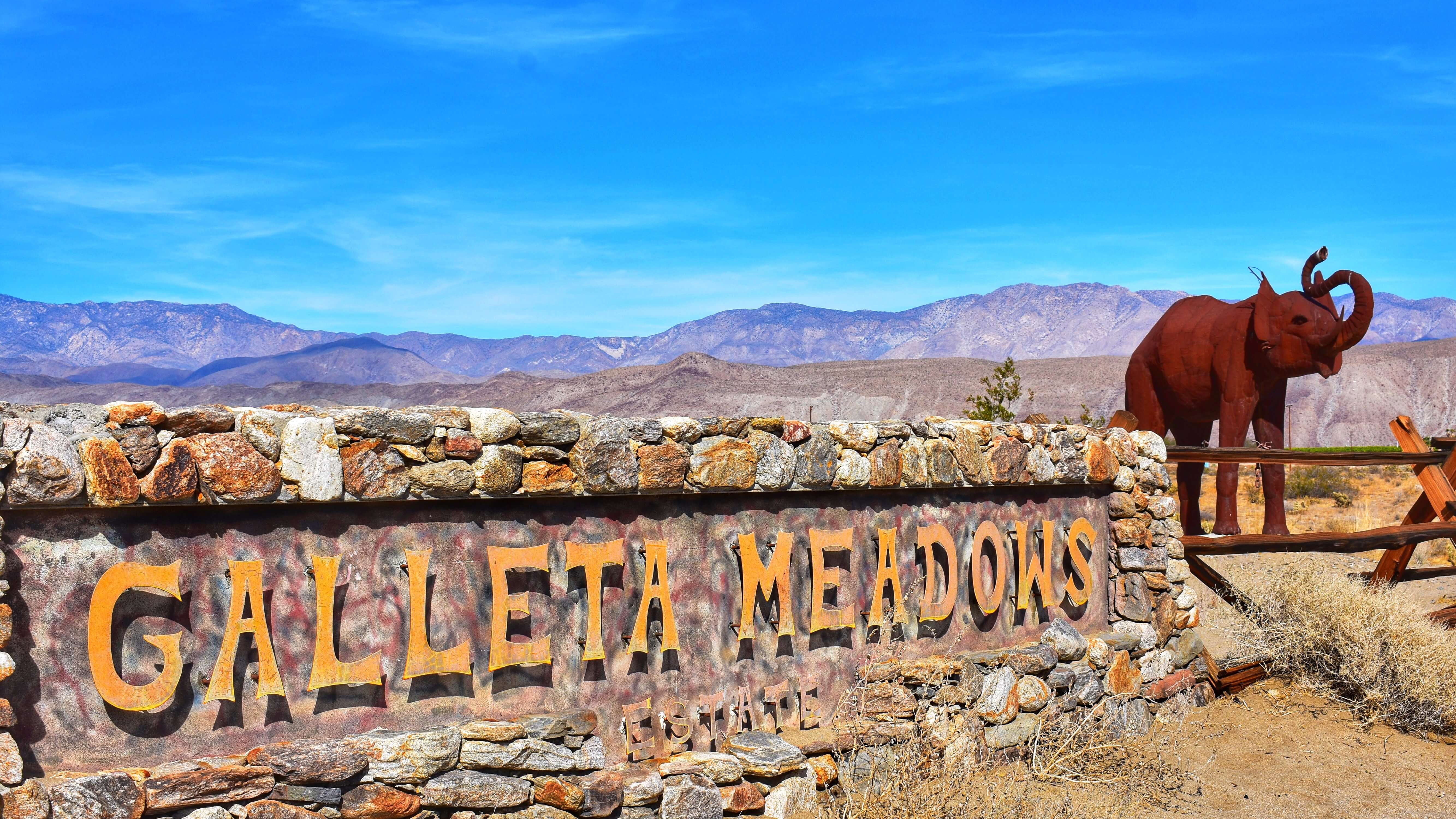 Galleta Meadows Sign with elephant sculpture in the background