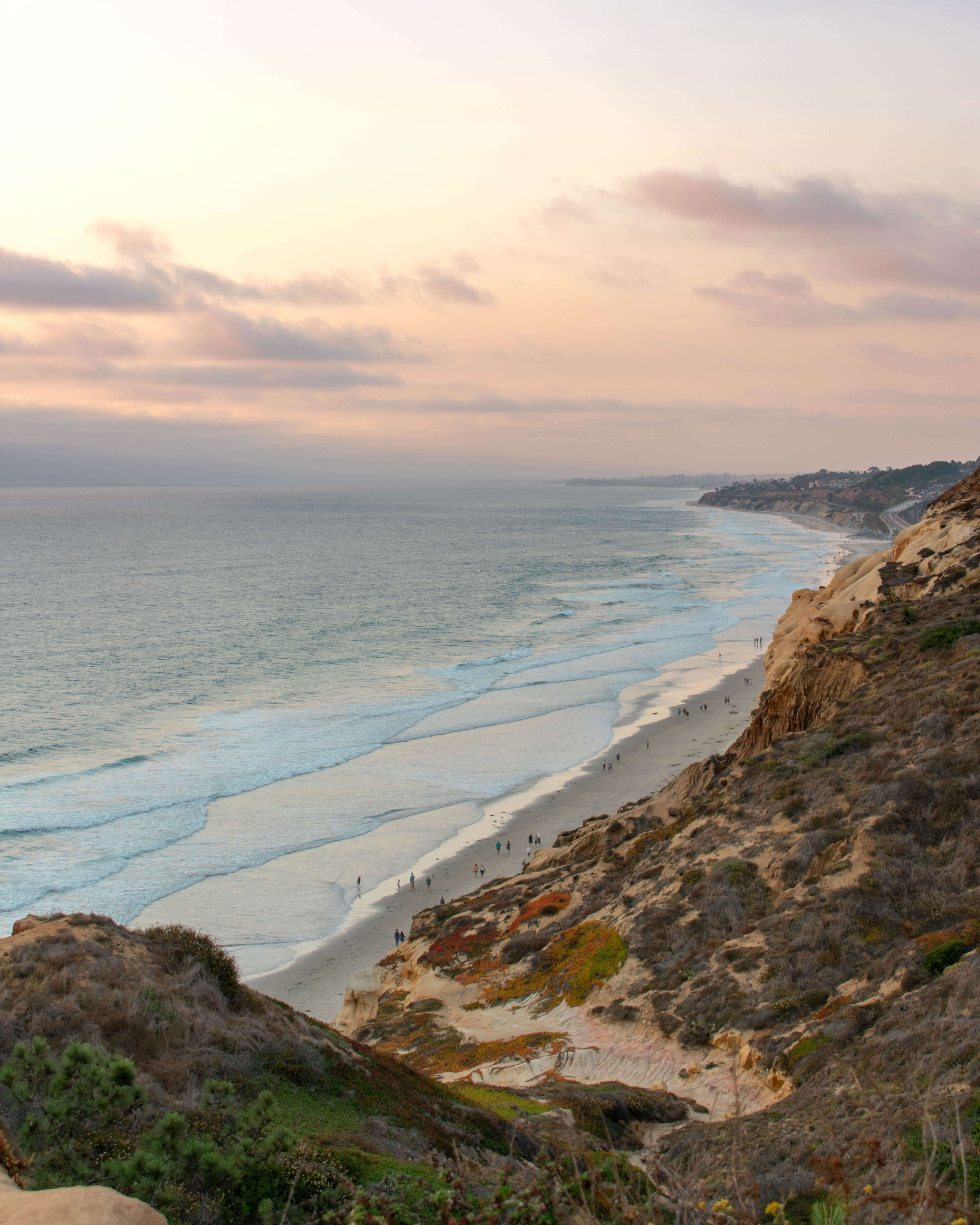 sunset view from a cliff overlooking the ocean at Torrey pines state park