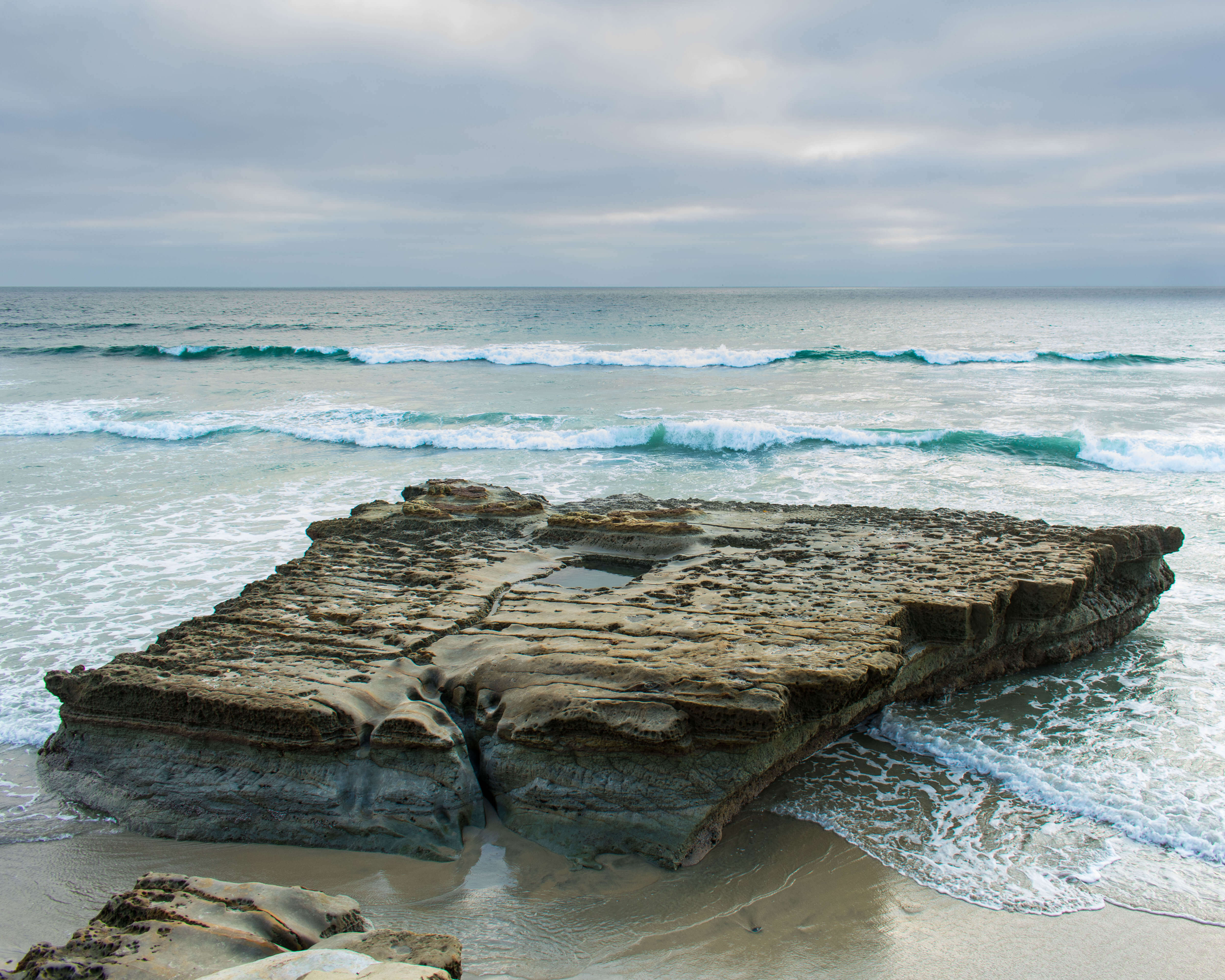 rock formation on the beach at Torrey pines state park overlooking the ocean