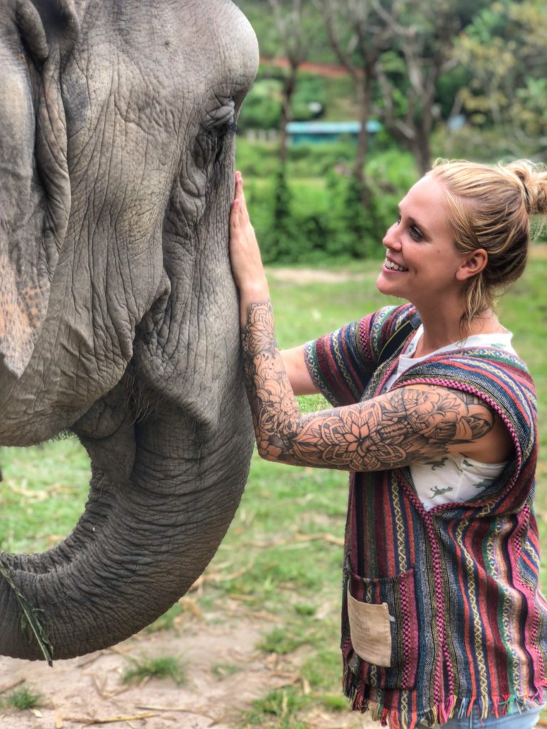 Me petting an elephant at the elephant jungle sanctuary